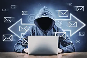 Cybercrime Protection Prints: man on a computer sending spam mail