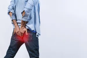 Digestive Issues Prints: Man with digestive problem touching his buttock