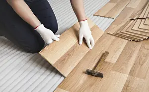 Laminate Flooring Installation Prints: Man installing laminated floor