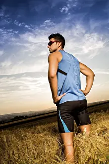 Recreational Activity Photo Prints: Man jogging through the fields