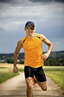 Male Jogger Prints: Man jogging through the fields