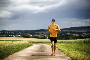 Athletic Male Prints: Man jogging through the fields