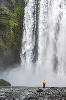 Young Man In Front Of Waterfall Prints: Man in front of large waterfall