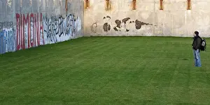 European Street Art Prints: Man looking at graffiti on a wall