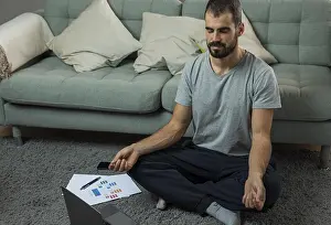 Calm And Serene Atmosphere Prints: Man meditating sofa before starting work