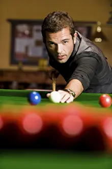 Young Man Playing Billiards Prints: Man playing billiard