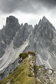 Dolomites Landscape Photography Prints: Man with red jacket standing on one degree
