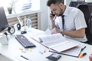 Professional Communication Tips Prints: A man is sitting in the office