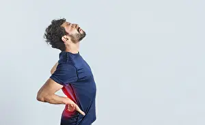 Young Adult Back Pain Prints: Man with spine problems, person with back problems on isolated background