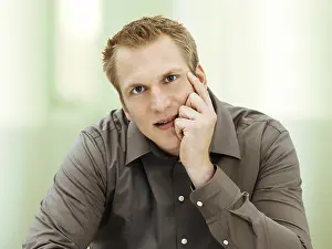 Business Professional Head Shot Prints: Man supporting his head on his hand