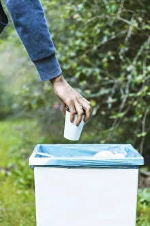 Environmental Protection Prints: Man throwing up garbage bin