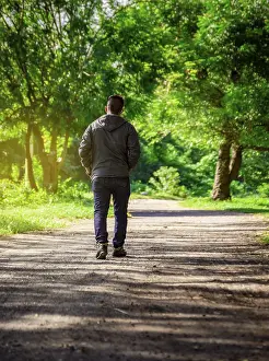 Latin American Ethnicity Image Prints: Man walking down a desolate road