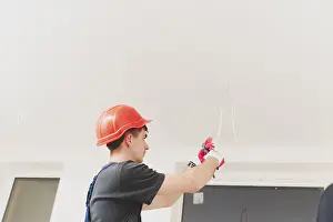 Manual Labor Work Prints: Man working with cables ceiling