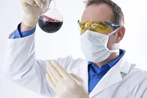 Caucasian Male Researcher Prints: Man working on an experiment in a laboratory