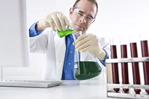 Laboratory Researcher Prints: Man working on an experiment in a laboratory