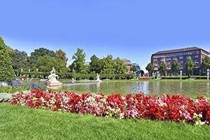 Prints of Mannheim, Germany, September 2020: Public park with fountain and flowers in city center of Mannheim called Friedrichsplatz Mannheim Prints: Mannheim, Germany Print: Friedrichsplatz City Center Scene