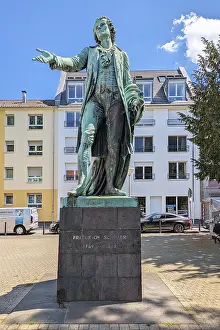 Prints of Mannheim, Germany - May 9th 2026: Friedrich Schiller monument on Schillerplatz in Mannheim Germany. Historic bronze statue of famous German poet Mannheim Prints: Mannheim, Germany - Friedrich Schiller Monument Print May 9th 2026