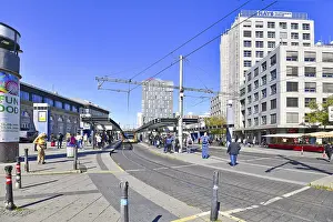 Prints of Mannheim, Germany, September 2020: Cable car and bus at station in front of Mannheim central train station on sunny day Mannheim Prints: Mannheim Central Train Station Print, September 2020