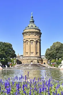 Prints of Mannheim, Germany, September 2020: Water Tower called Wasserturm, landmark of German city Mannheim in small public park with purple flowers on sunny day Mannheim Prints: Wasserturm Mannheim Print, Germany, September 2020