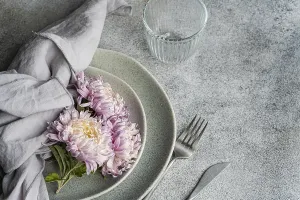 Elegant Floral Arrangement Prints: A soft, rustic dining setup features pink
