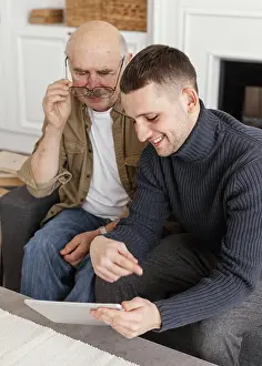 Healthcare System Prints: Medium shot men looking tablet