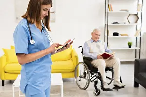 Healthcare Professionals Prints: Medium shot nurse checking her tablet