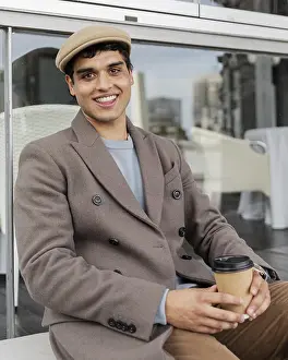 Hot Beverage Prints: Medium shot smiley man with coffee