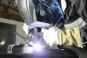 Workplace Safety Prints: Metal worker during welding work