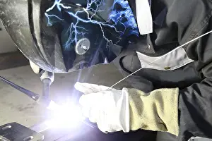 Workplace Safety Prints: Metal worker during welding work