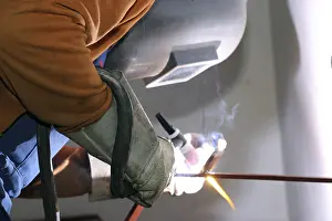 Flame Protection Gear Prints: Metal worker during welding work