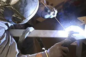 Workplace Safety Prints: Metal worker during welding work