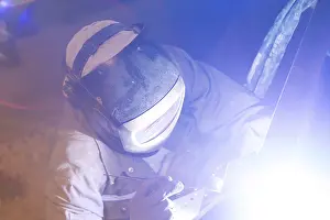 Workplace Safety Prints: Metal worker during welding work