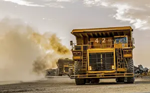 Construction Site Equipment Prints: Mining dump trucks transporting Platinum ore for processing