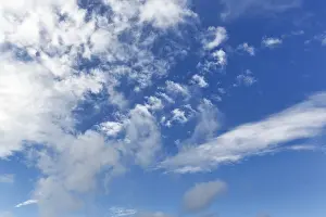 Cloud Formations Prints: Mixture of different cloud formations on a blue sky