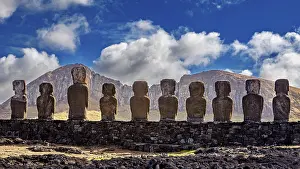 Easter Island Landscape Prints: Moai statues against a mountain backdrop and dramatic sky with clouds