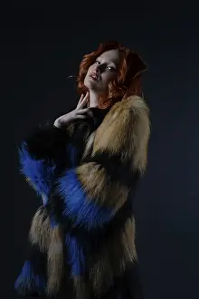 Fashionable Female Prints: Model stands gracefully in a studio