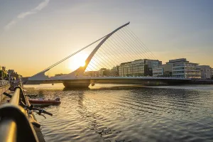 Contemporary Irish Architecture Prints: Modern bridge over a river at sunset