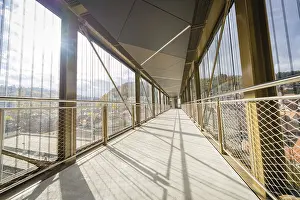 Sun Rays Germany Prints: Modern footbridge with sun rays and shadows through the grid
