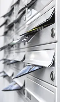 Shallow Depth Of Field Photography Prints: Modern mailboxes filled of leaflets