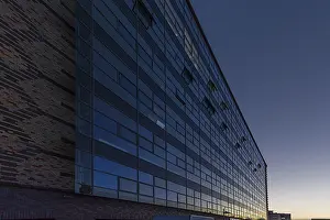 Prints of Modernized facade of the former egg cold store at dusk, built 1929, today German headquarters of Universal Music, Kreuzberg, Berlin, Germany Related Prints: Modernized Facade Print of 1929 Egg Cold Store, Berlin