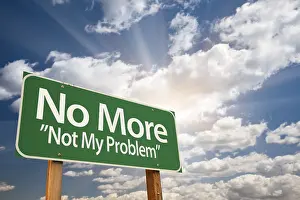 Road Safety Signs Prints: No more, not my problem green road sign with dramatic clouds and sky