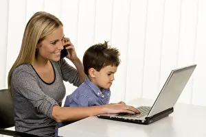 One Person In The Office Prints: Mother and son at the computer