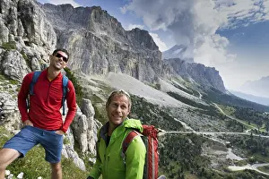 Hiking Trail Prints: A mountain guide and client looking up and checking out the climbing route before them