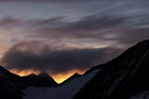 Dramatic Clouds Austria Prints: Mountain ridge at sunrise with dramatic clouds