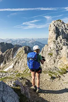 Bavarian Mountain Range Prints: Mountaineer with backpack looking over mountains