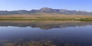 Mountain Peak Reflection Prints: Mountains reflecting in a lake along the At-Bashy Range
