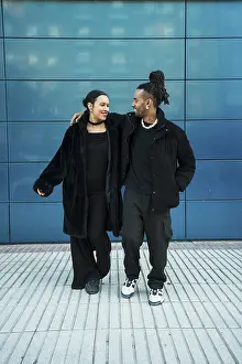 Couple Embracing Love Prints: A multicultural couple embraces
