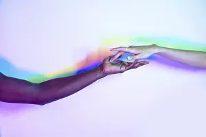 Multiethnic Unity Prints: Two multiethnic hands reaching towards each other