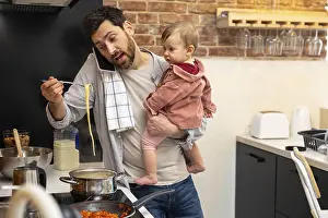 Breakfast At Home Prints: Multitasking father babysitting