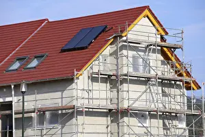Residential Construction Site Prints: New building with completed basic rendering of the exterior facade New building with completed basic rendering of